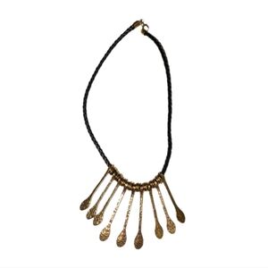 Gold Necklace on Black Rope